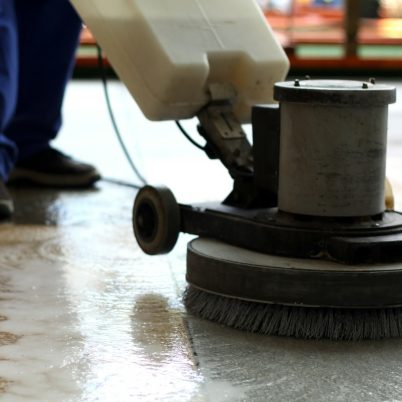 Cleaning machine washing the floor in a shopping mall