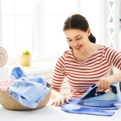 woman is ironing at home